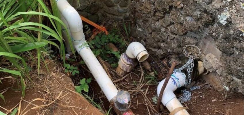 PVC plumbing pipes and valves in soil
