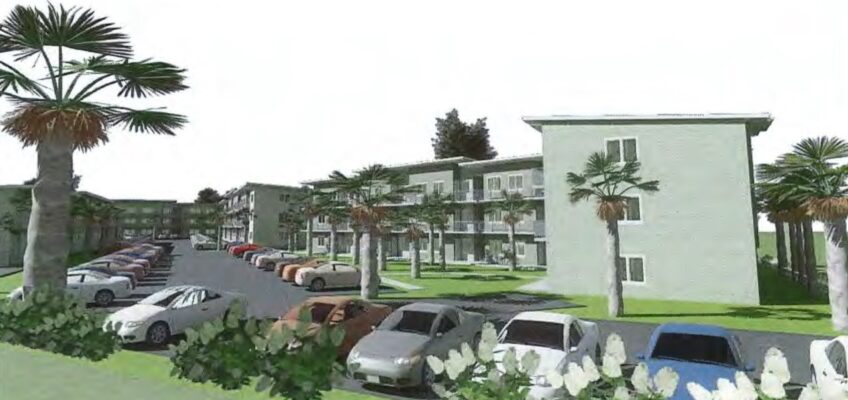 Apartment complex with palm trees and parked cars