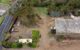 Aerial view of coastal construction site with palms