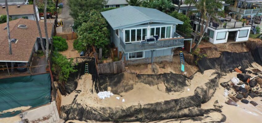 Beachfront house with black erosion control fabric