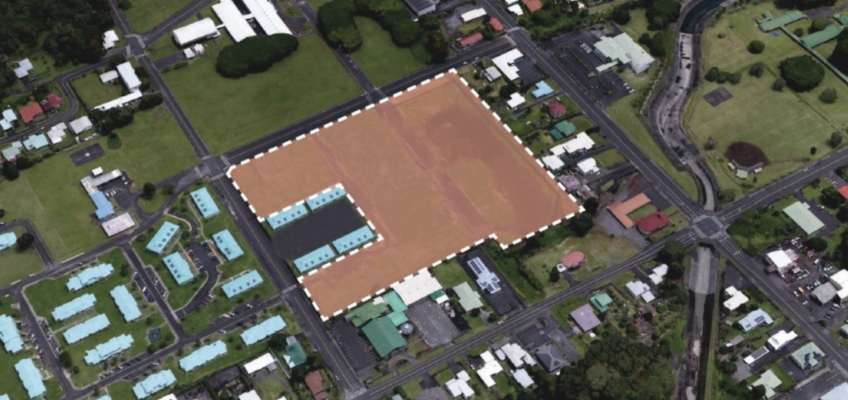 Aerial view of outlined vacant lot in neighborhood