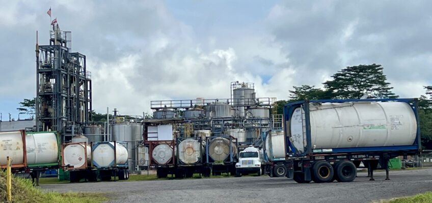Industrial chemical plant with tanker trucks